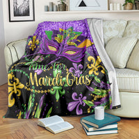 Purple Mardi Gras themed blanket with glitter purple background and fleur-de-lis mask design