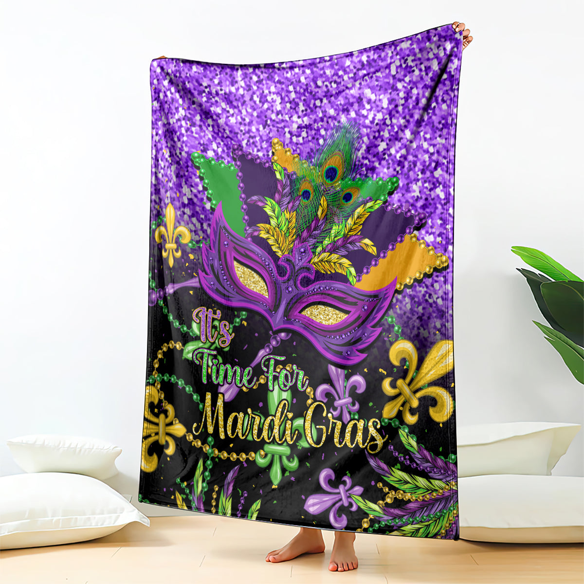 Purple Mardi Gras blanket featuring decorative mask, peacock feathers, and “Time for Mardi Gras” text