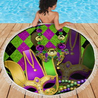Round beach blanket with colorful jester mask center and purple bead strings