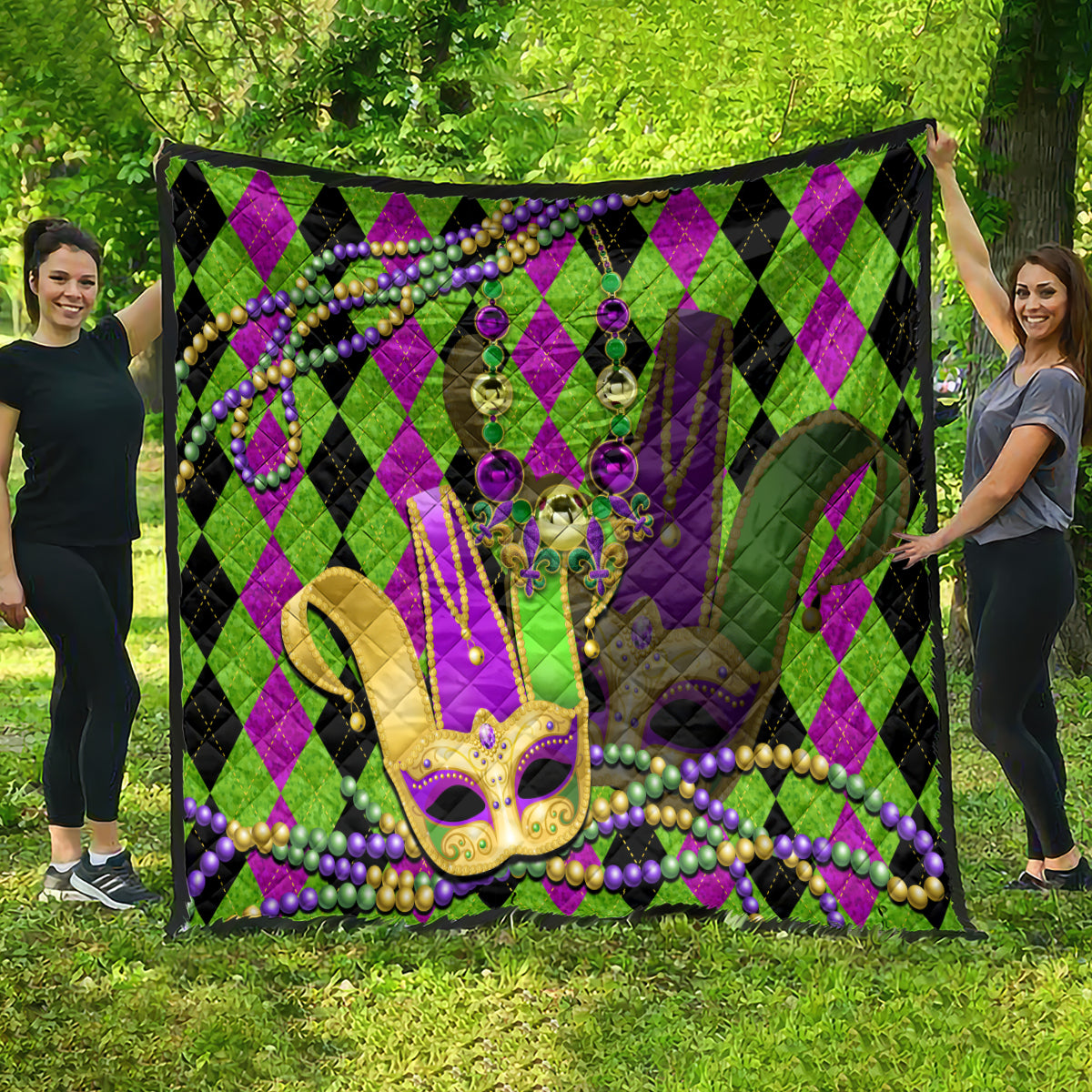 Mardi Gras jester mask quilt, full view on grass, purple-green diamonds with bead trim
