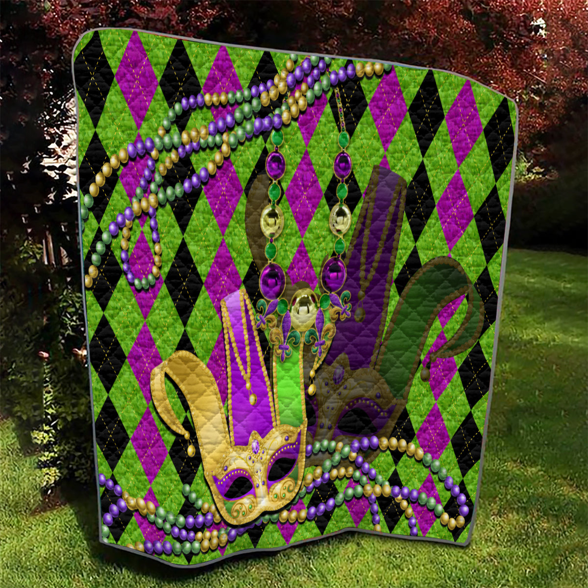 Mardi Gras jester mask quilt outdoors, large jester mask graphic with purple and green beads