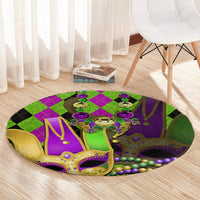 Round jester mask carpet with purple center, green diamonds, gold trim, and bead accents