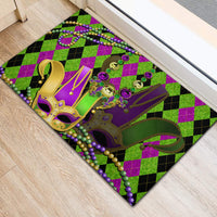 Purple, green, and black plaid rubber doormat with jester mask and bead garland
