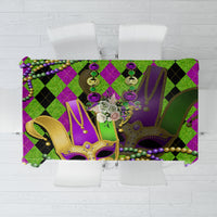 Colorful Mardi Gras tablecloth with green and purple jester mask graphics and bead fringe accents
