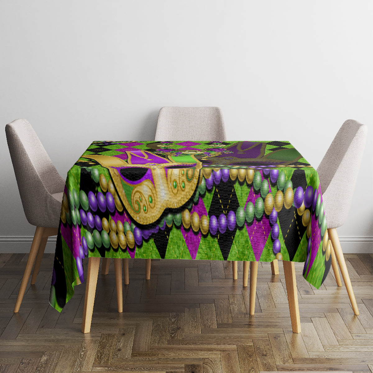 Colorful Mardi Gras tablecloth with jester mask artwork and bead garlands in green, purple, and gold