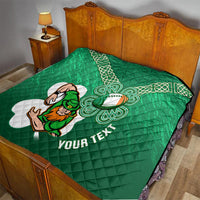 Green quilt blanket on a bed with white Celtic knots, shamrock rugby mascot, and diagonal text.
