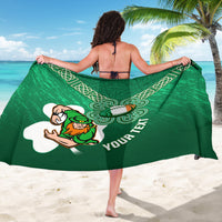 Green rugby sarong with Celtic knot pattern and football mascot graphic, worn
