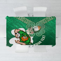 Green rugby tablecloth with Celtic knot shamrock pattern and leprechaun rugby graphic.