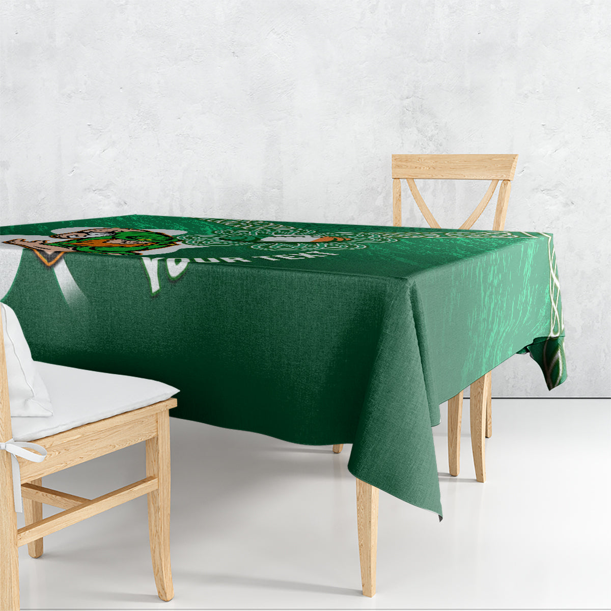 Green tablecloth draped over table, with rugby mascot and Celtic knot trim design.