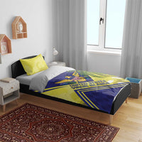 Blue and yellow duvet set on bed with eagle crest, palm leaves, and striped graphics