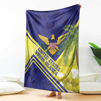 Folded blue and yellow blanket with United States Virgin Islands text, eagle and palm graphics