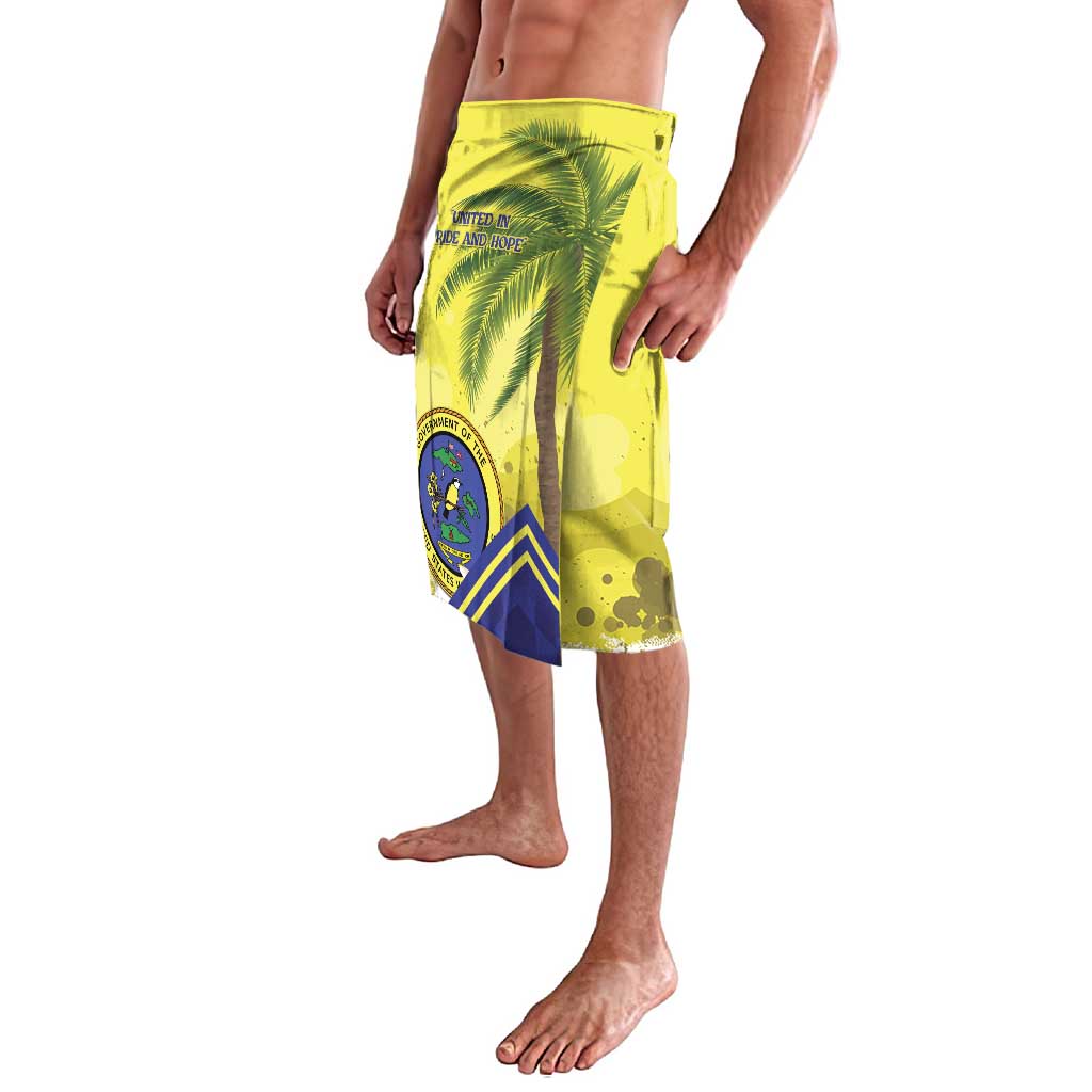 Yellow lavalava shorts with blue geometric panel, palm tree, and badge graphic