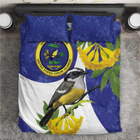 Blue, yellow, and white bedding set with bird and seal emblem; includes two pillowcases