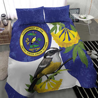 Blue duvet and pillowcases with black-and-yellow bird and circular seal logo