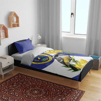 Blue bird and seal bedding set on bed with two blue pillowcases and patterned duvet