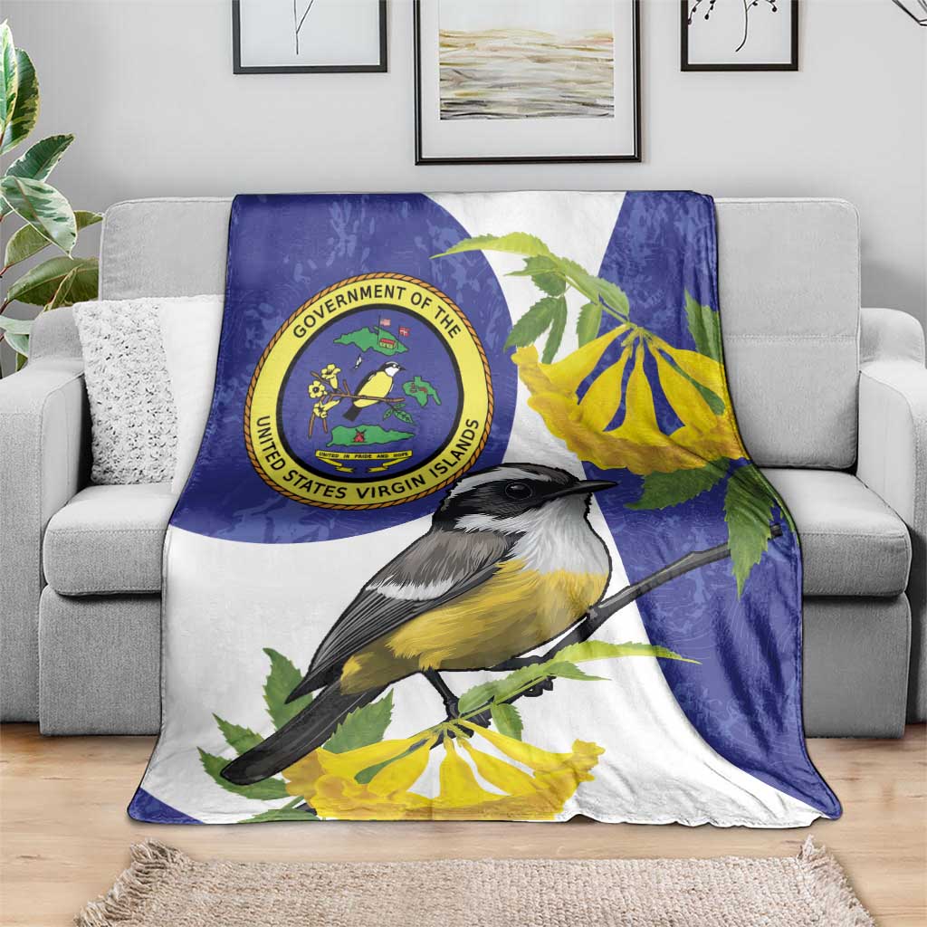 Blue and white bird print blanket draped on sofa with yellow flowers and seal