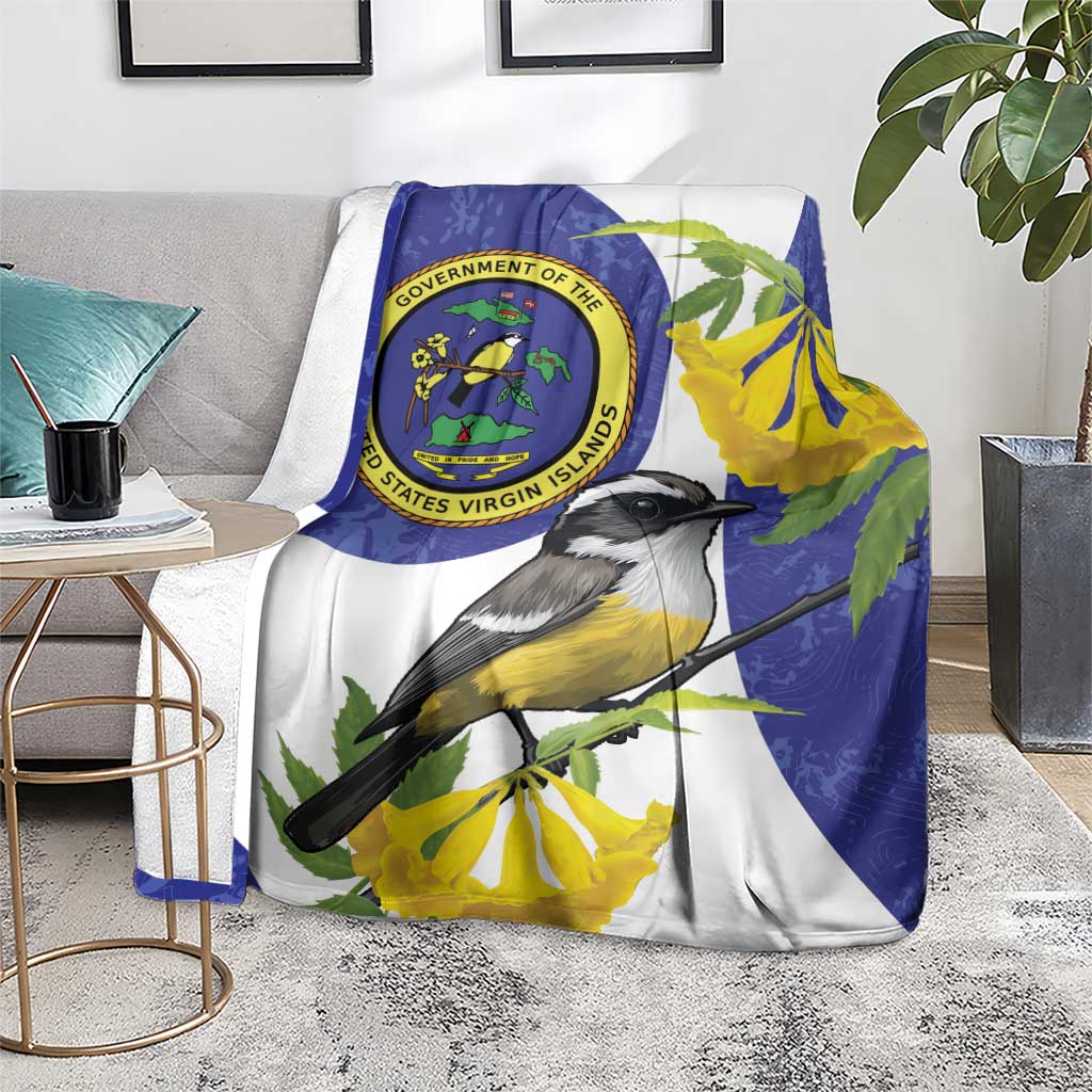 Blue and white bird print blanket on chair with Virgin Islands seal and yellow blossoms