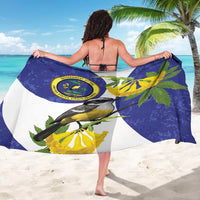 Blue and white sarong with banana leaves and bird artwork, wrapped and tied at the waist