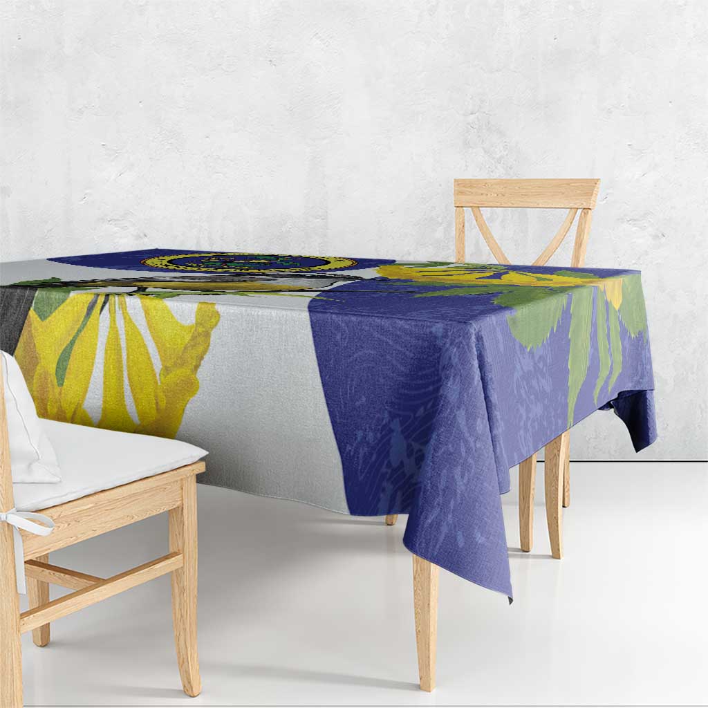 Blue tablecloth with banana flower and bird motif draped over table