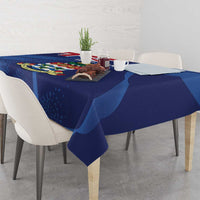 Blue tablecloth with Cayman coat of arms graphic and grunge texture across table