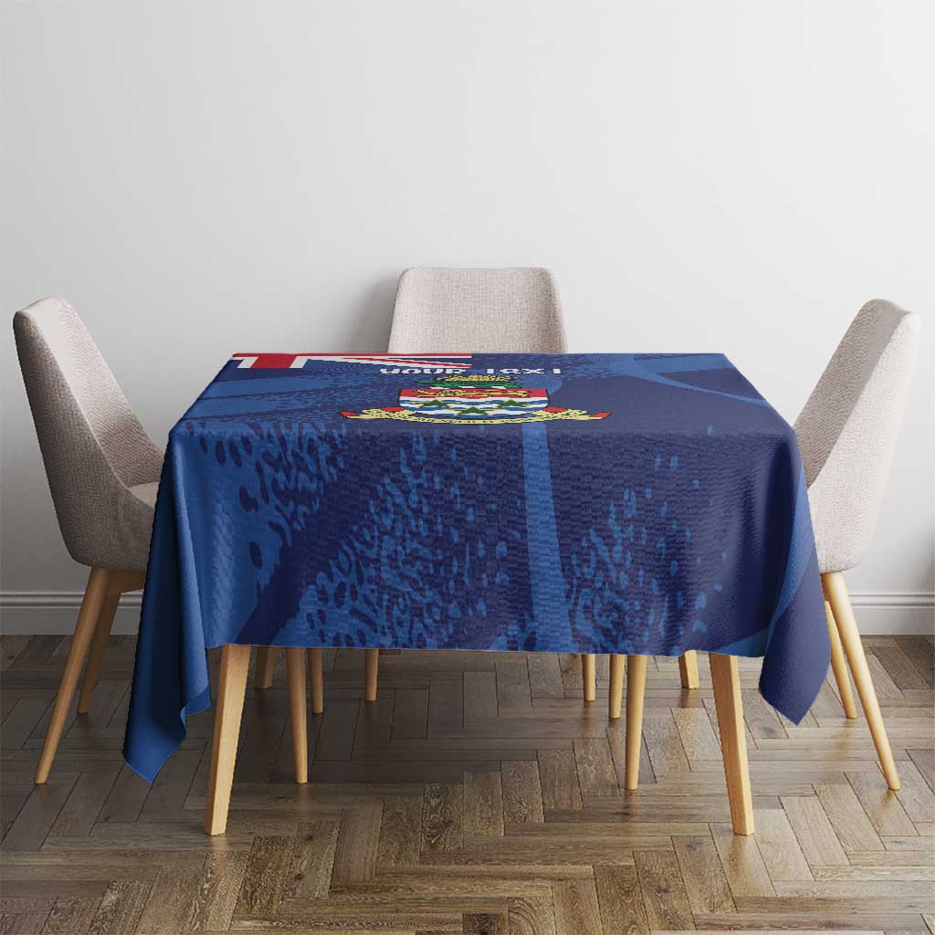 Blue grunge-style tablecloth featuring Cayman coat of arms on dining table