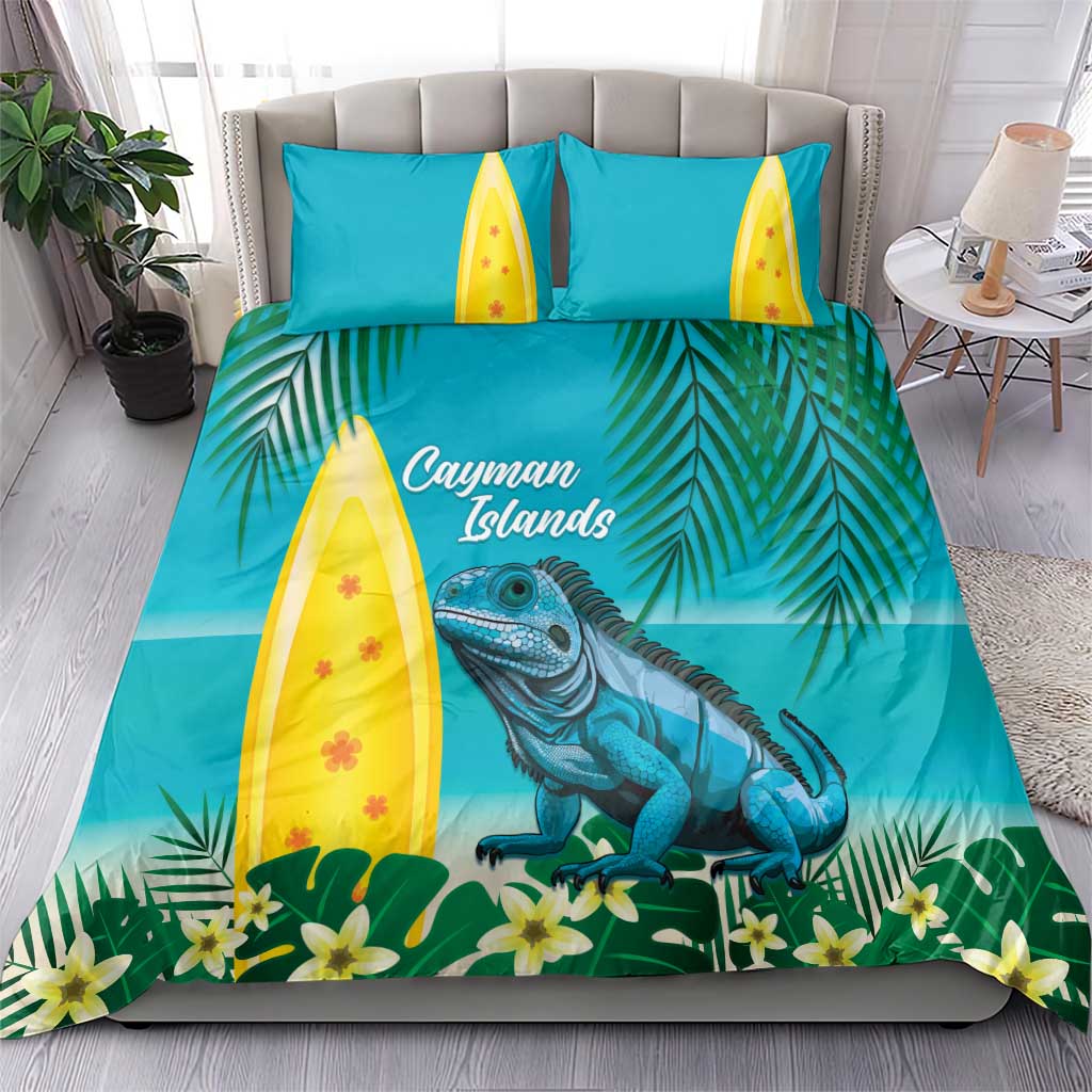 Turquoise bedding set on bed: blue iguana, palm leaves, yellow surfboard pillows