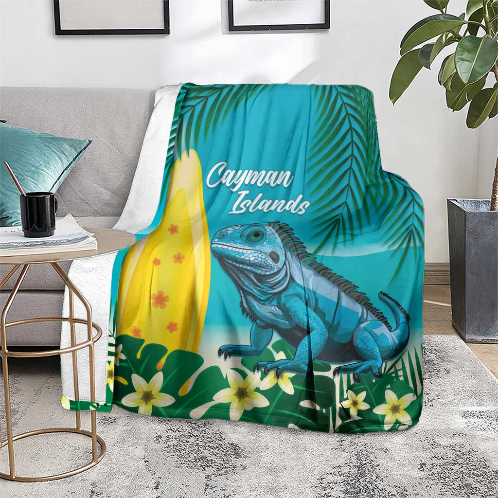 Turquoise tropical blanket with blue iguana, palm leaves, and yellow surfboard