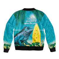 Turquoise bomber jacket with black ribbed trim, full zip, iguana and surfboard graphic back