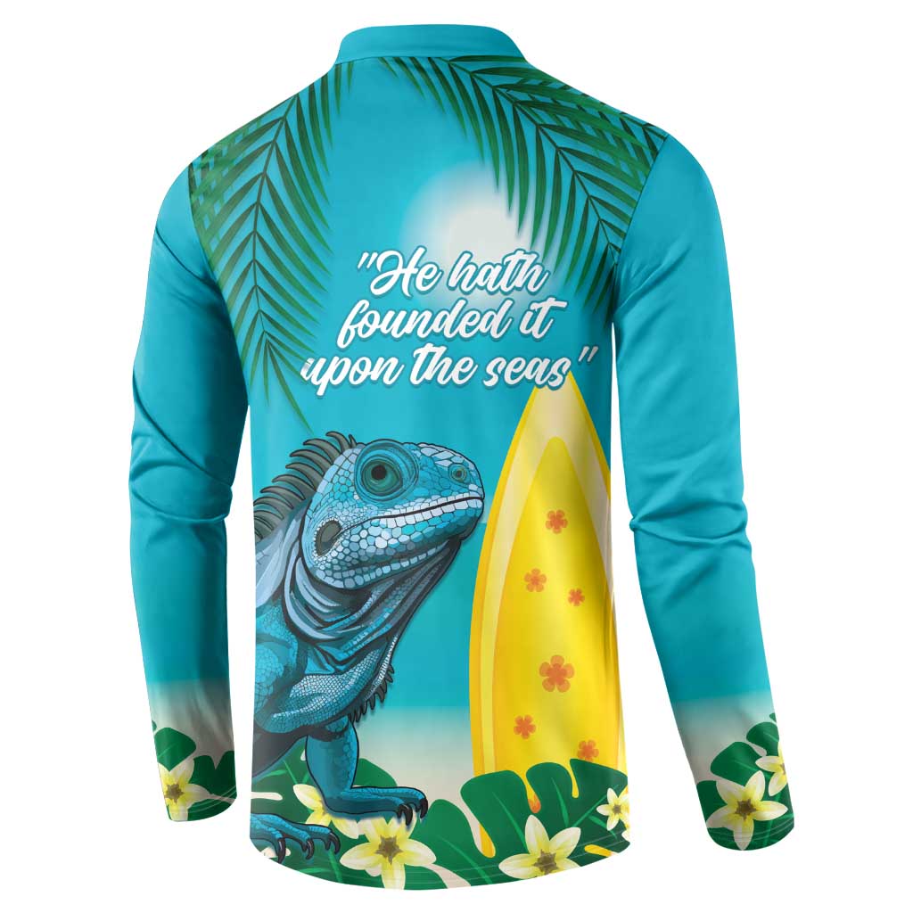 Turquoise button sweatshirt with back quote and iguana near a yellow surfboard