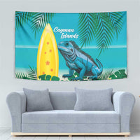 Turquoise tropical tapestry showing palm fronds, yellow surfboard, blue iguana, Cayman Islands text
