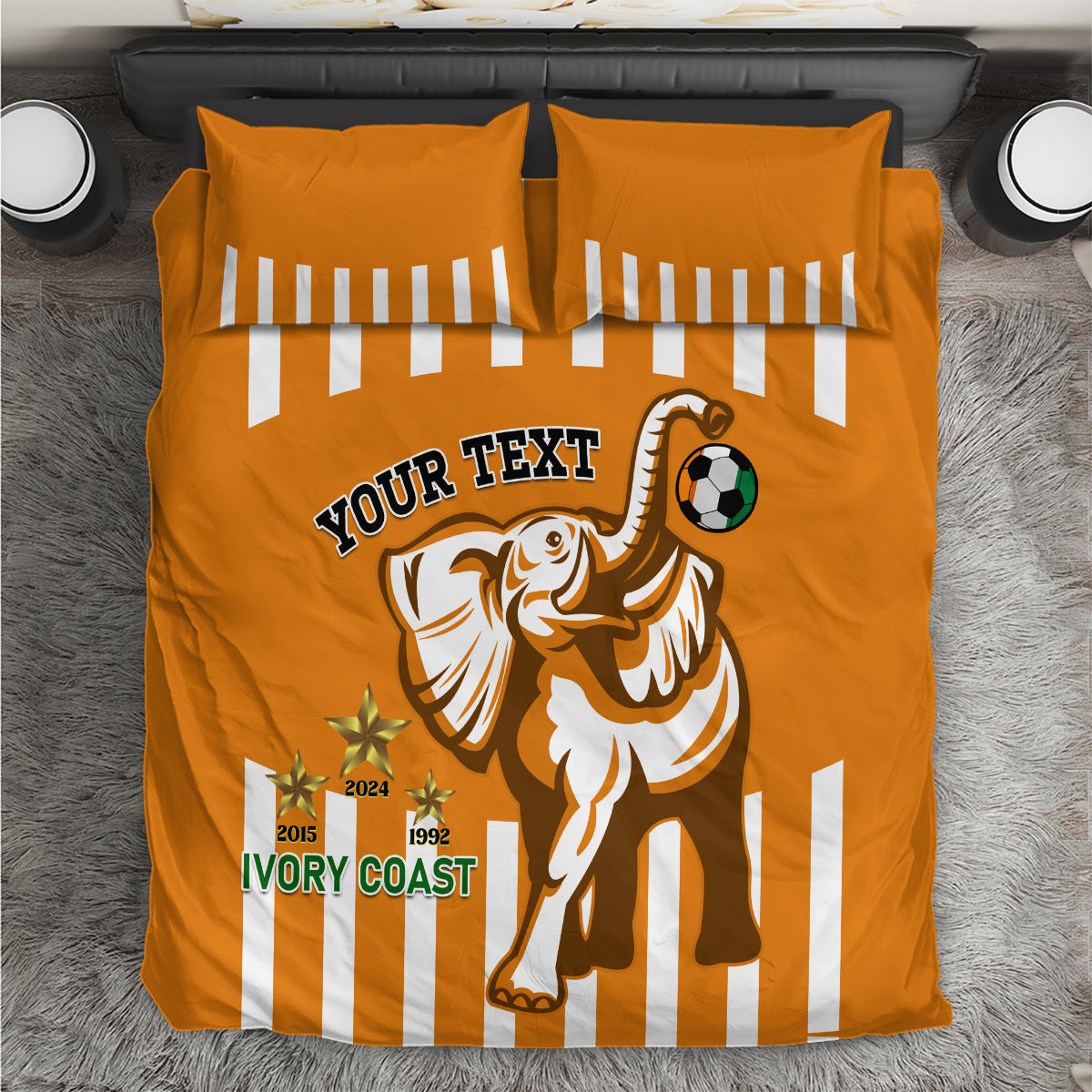 Orange football bedding set with two striped pillowcases and elephant soccer graphic