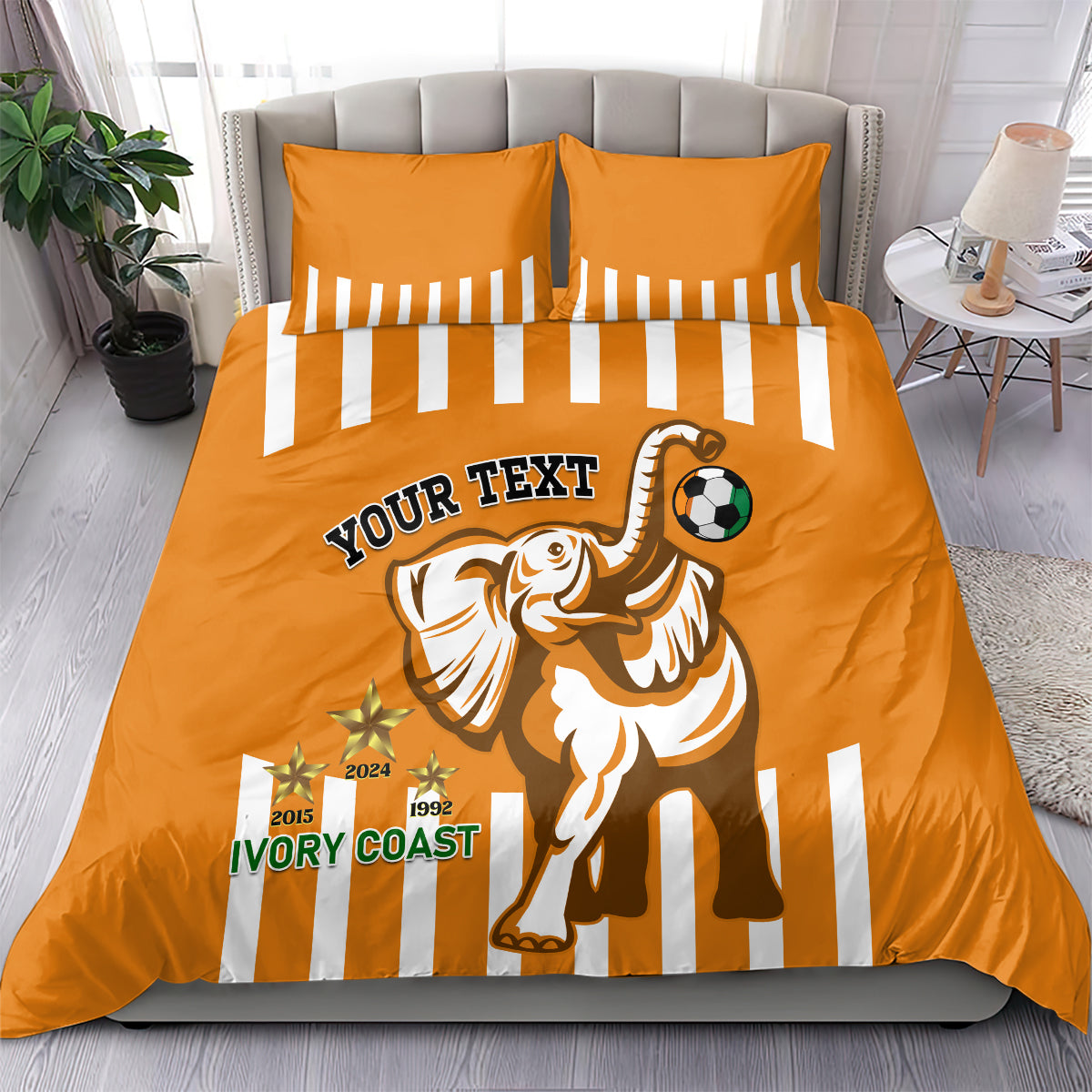 Orange football bedding set with duvet and two pillowcases featuring elephant and soccer ball