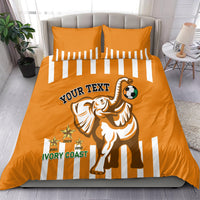 Orange football bedding set with duvet and two pillowcases featuring elephant and soccer ball