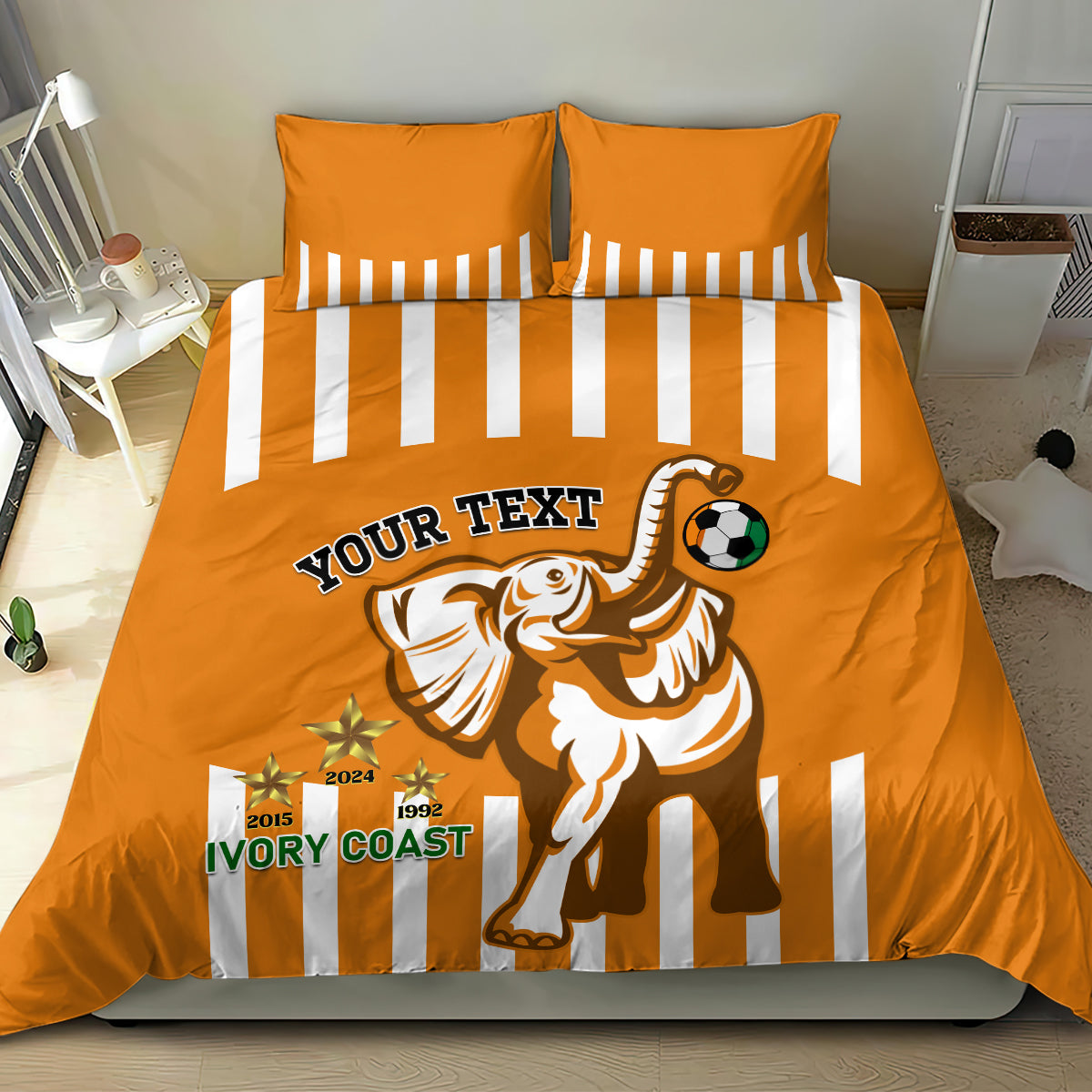 Orange football bedding set with two striped pillowcases and duvet with elephant and ball