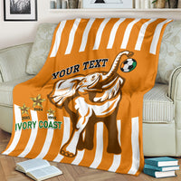 Football blanket in orange with white stripes, elephant mascot and soccer ball graphics