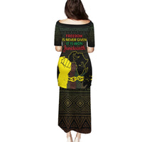 Black long dress, back view with short sleeves, Juneteenth text and geometric print
