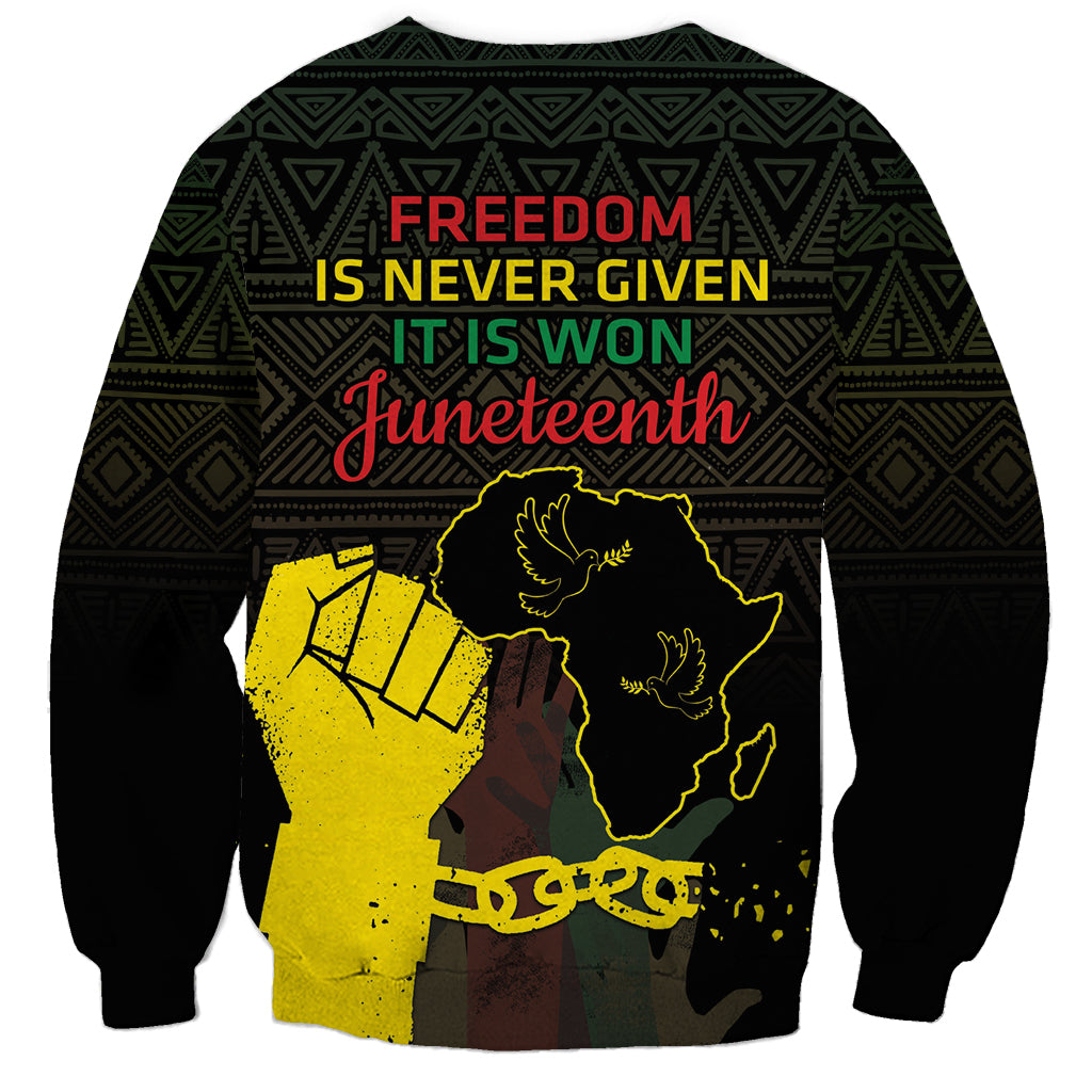 Black crewneck sweatshirt with slogan 'Freedom is never given' and Juneteenth Africa graphic