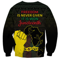 Black crewneck sweatshirt with slogan 'Freedom is never given' and Juneteenth Africa graphic