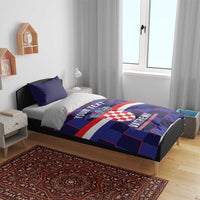 Blue football duvet set on bed with crest and red-white stripes, “VATRENI” lettering