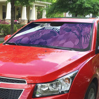 Purple windshield sun shade on red car, leaf and thistle graphic