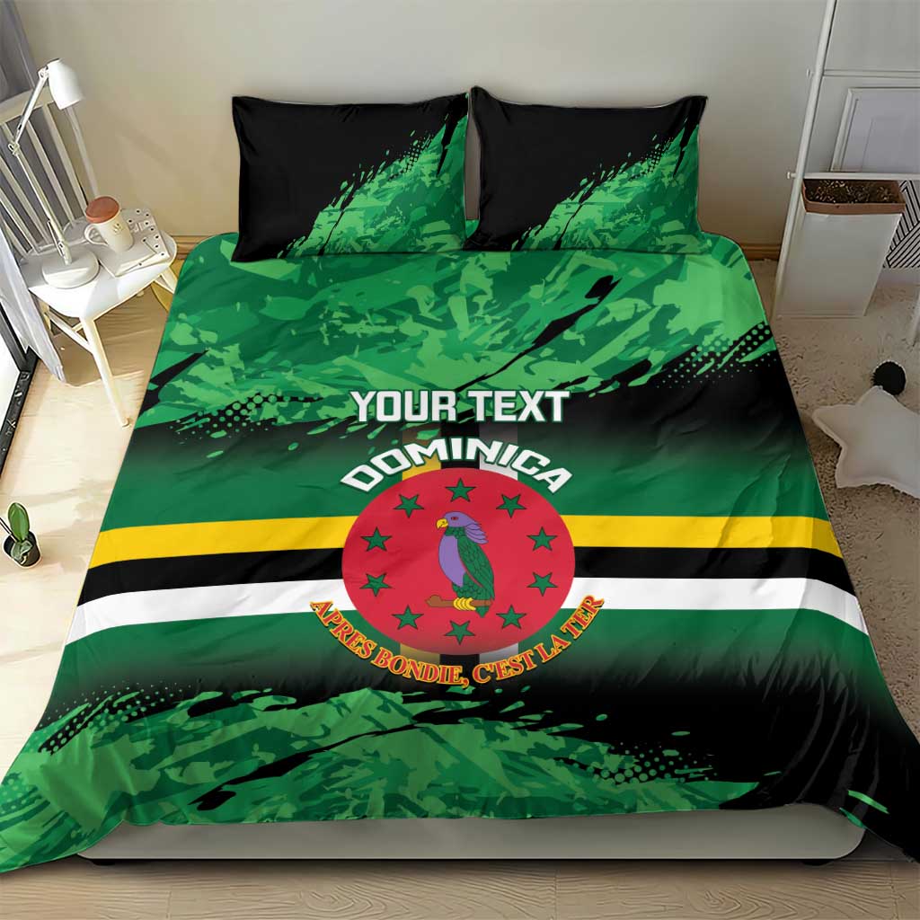 Personalized Dominica bedding set on bed with green/black graphic camo, crest, and “YOUR TEXT”