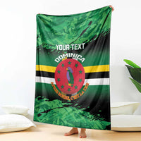 Green printed throw blanket with Dominica crest emblem, stripes, and 'YOUR TEXT'