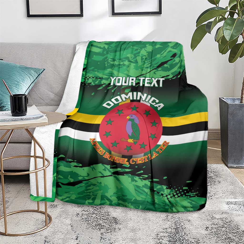 Green printed throw blanket with Dominica crest, stripes, and customizable 'YOUR TEXT'