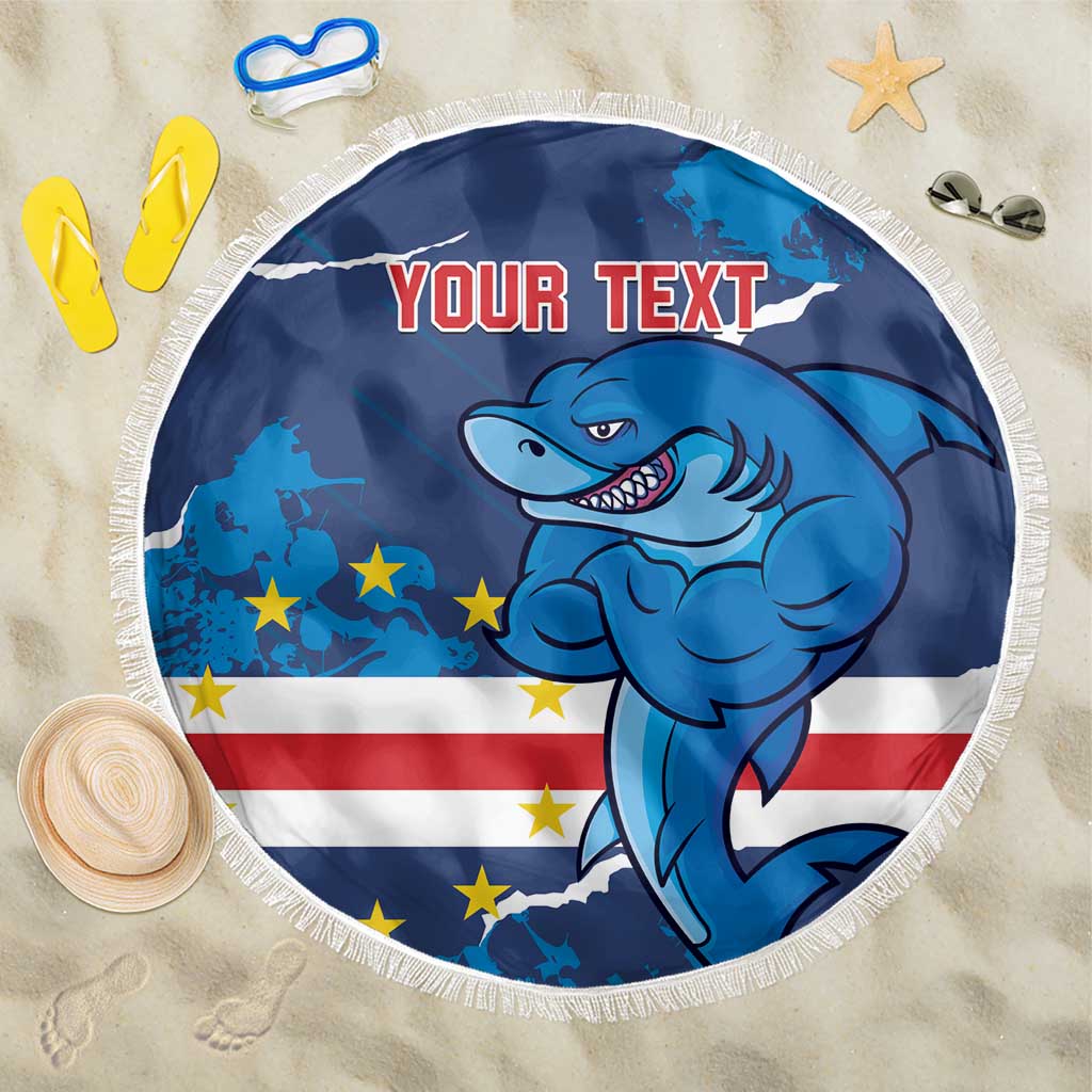 Blue round beach blanket with white fringe, shark mascot and “YOUR TEXT” print