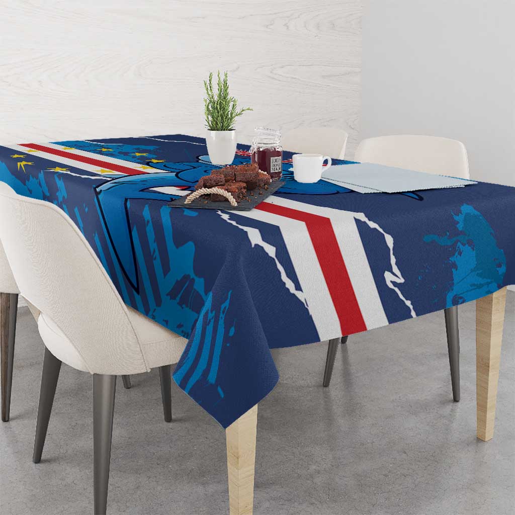 Blue football tablecloth draped over table with dolphin mascot and red-white stripe panel