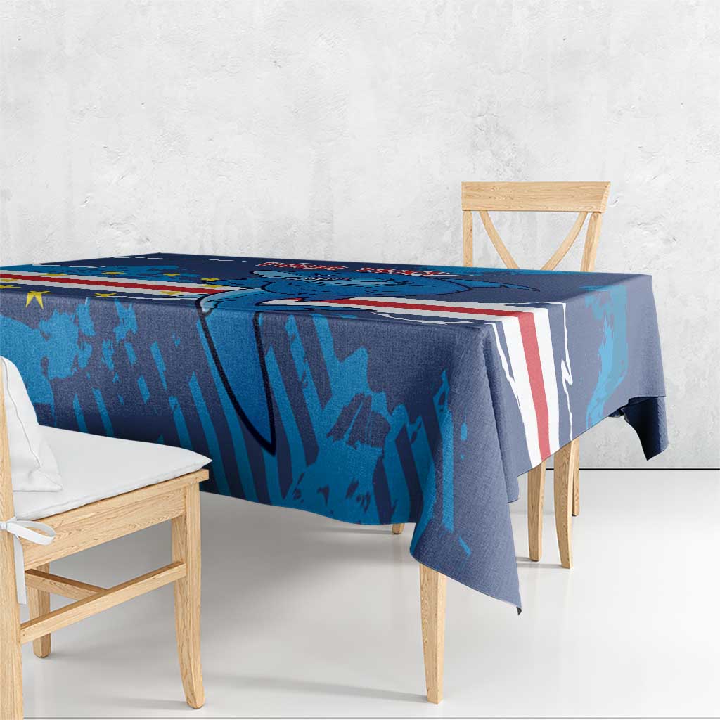 Blue football tablecloth edge view with dolphin artwork and red-white stripes