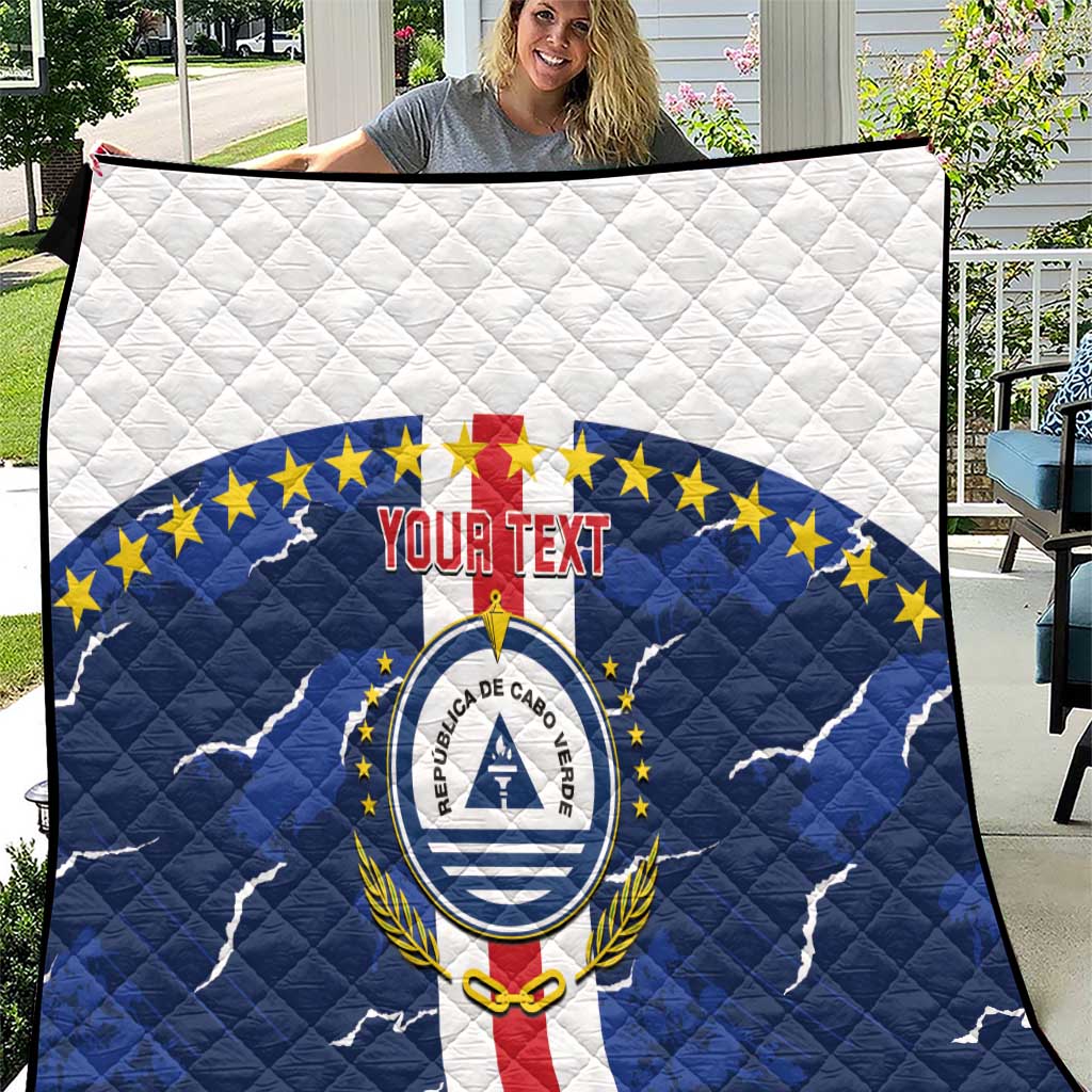 Blue and white quilted football throw blanket with crest and red “Your Text” banner
