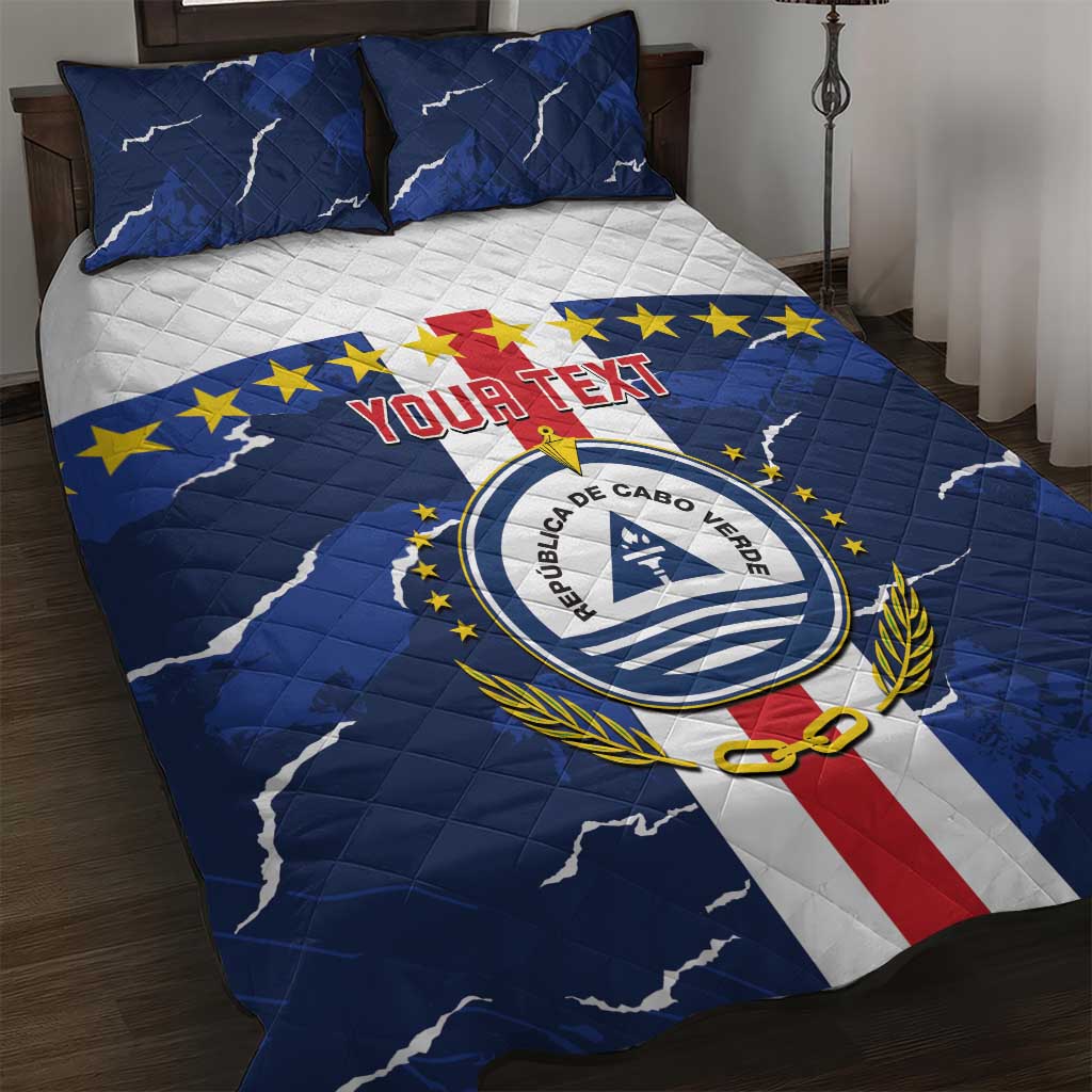 Blue quilt bed set with Republic of Cabo Verde emblem, white stripe and two pillows