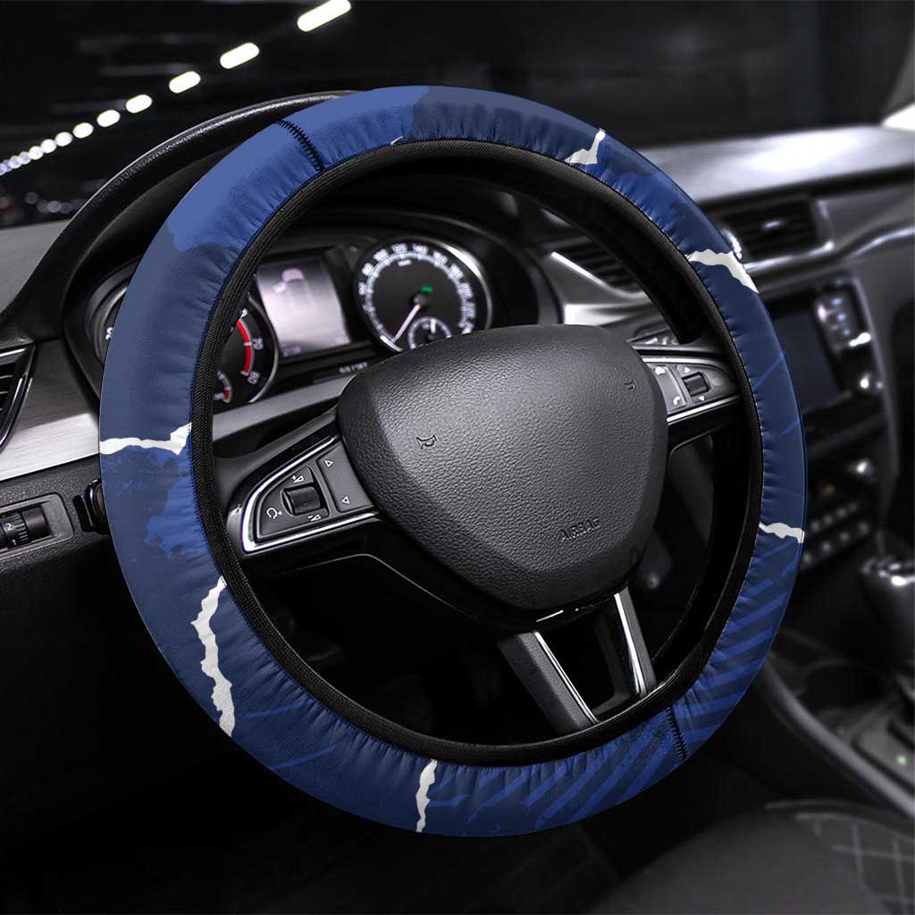 Blue padded steering wheel cover with white graphic accents and black inner rim