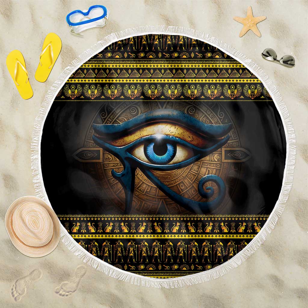 Round beach blanket with white fringe, black base and blue Eye of Ra print with border